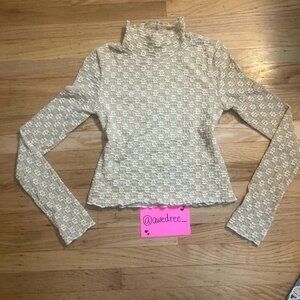 elegant floral turtleneck top